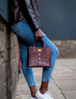 model using radiance leather bag