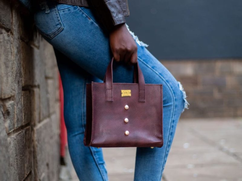 model using radiance leather bag