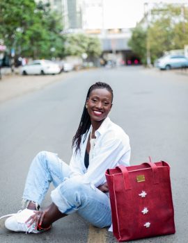 model sitting with radiance leather bag