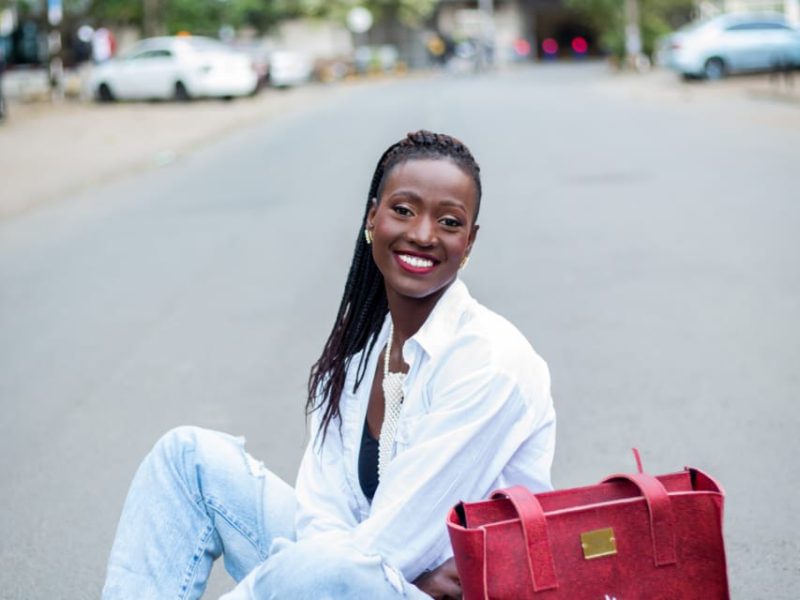 model sitting with radiance leather bag